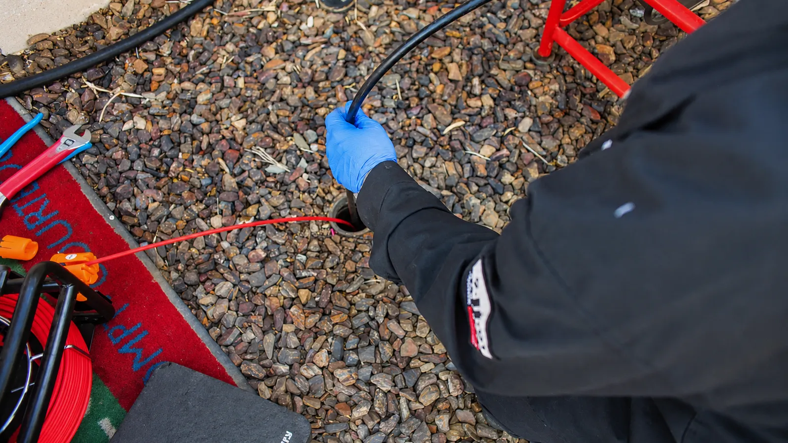 Feeding a camera line into a drain cleanout