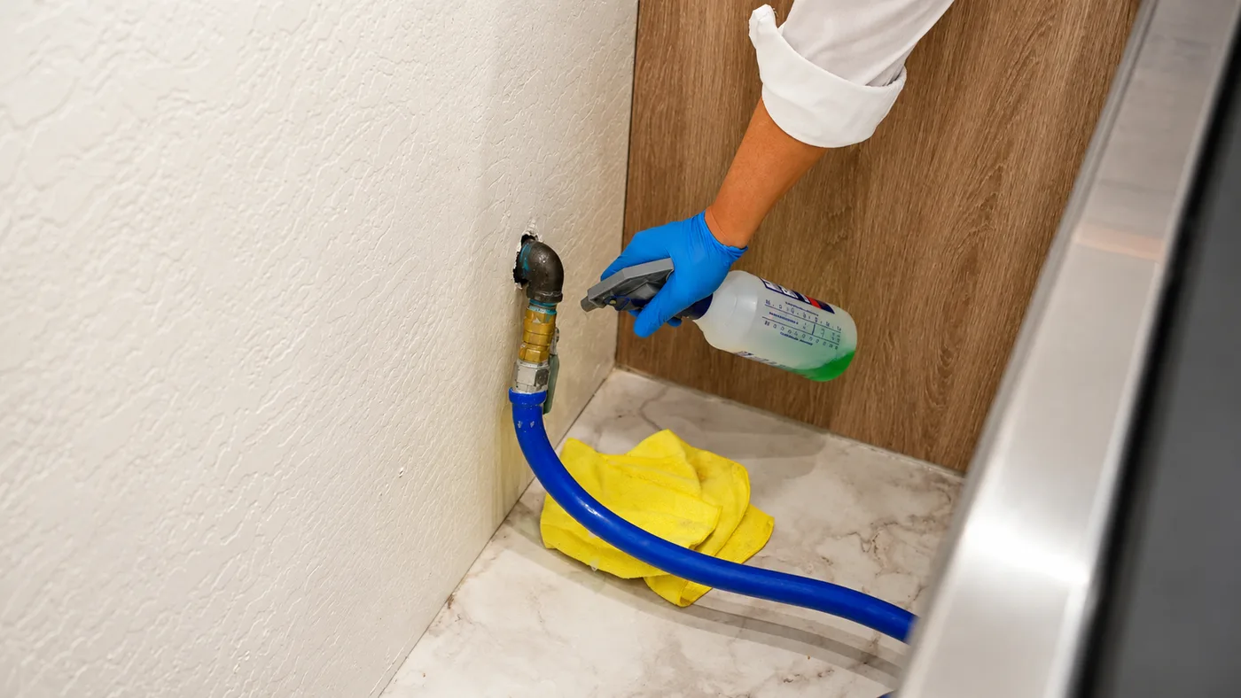 Leak testing a gas valve behind an appliance