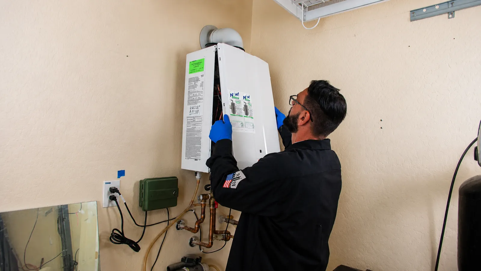 Now plumbing tech installing a tankless water heater