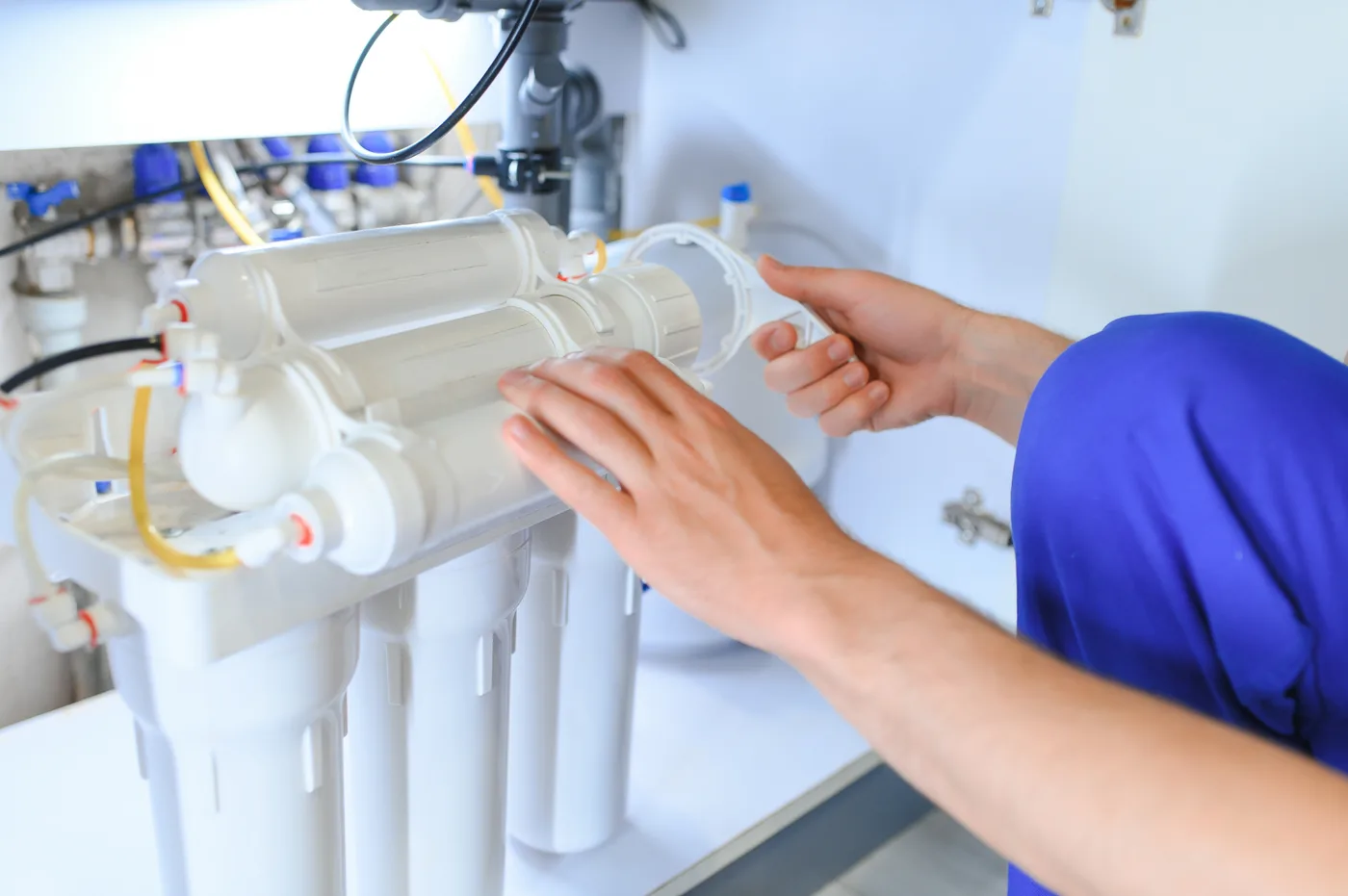 Installing a reverse osmosis system under a kitchen sink