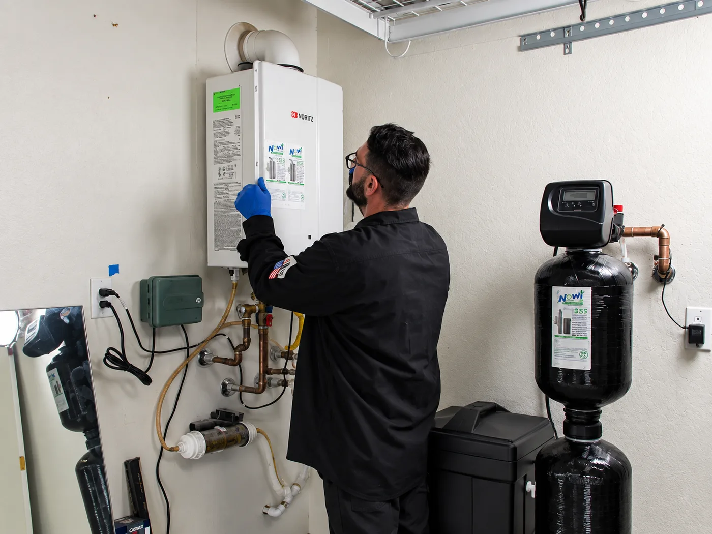 Now plumbing tech servicing a noritz tankless unit
