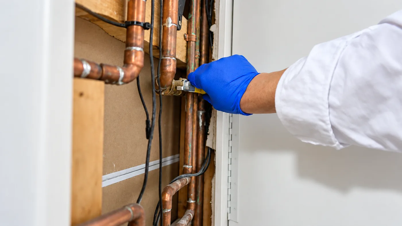 Copper water lines opened up in a wall for re piping